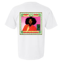 Back view of a white T-shirt featuring an album cover image of Alice Coltrane in a bright orange robe against a bright pink background, framed with green lotus patterns.