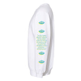 Side view of a white crewneck sweatshirt sleeve with lotus symbols and spiritual text in blue and yellow, featuring the quote 'When you quiet your mind, you can enter a world of clarity, peace, and understanding