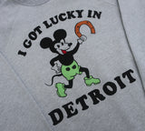 Gray crewneck sweatshirt with 'I Got Lucky in Detroit' and vintage mickey mouse character holding a horseshoe