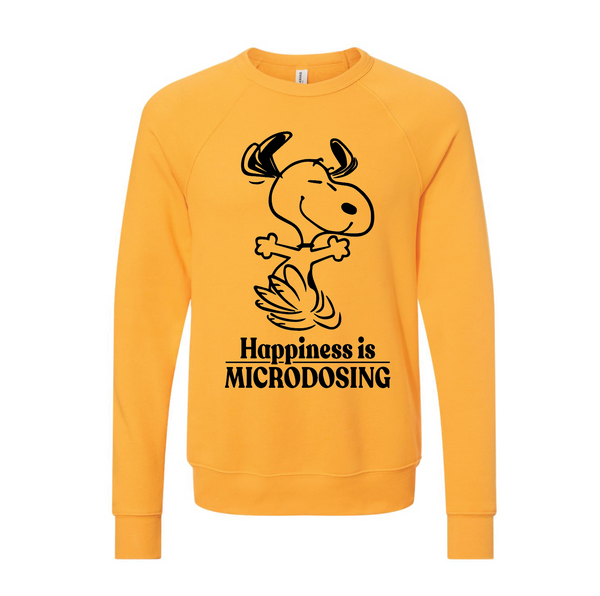 Yellow crewneck sweatshirt featuring a cartoon Snoopy with the text 'Happiness is Microdosing' below in black ink