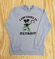 Gray crewneck with 'I Got Lucky in Detroit' text and vintage cartoon mickey mouse holding a horseshoe