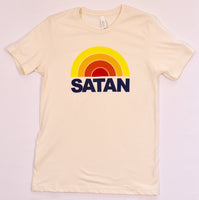 Beige t-shirt featuring a retro-style rainbow design above the bold text 'SATAN' in navy blue