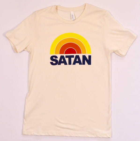 Beige t-shirt featuring a retro-style rainbow design above the bold text 'SATAN' in navy blue