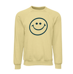 Light yellow crewneck sweatshirt featuring a simple, bold retro-style smiley face graphic in black ink on the front